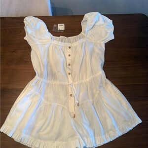 freePeople - White Button-Down romper with Puff Sleeves. Ties in the waist